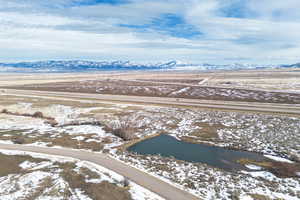 Snowy aerial view featuring a mountain view