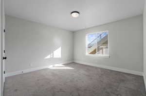 Empty room with carpet floors