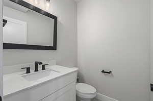 Bathroom with toilet and large vanity