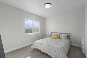 Bedroom featuring carpet flooring