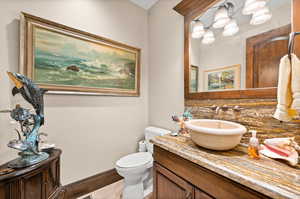 Bathroom with large vanity and toilet