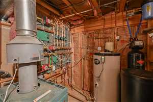 Utility room with radiant heating system and water heater
