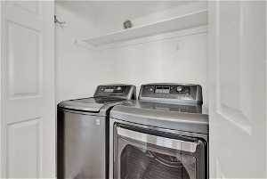 Laundry room featuring washer and dryer in apartment