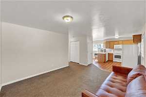 View of carpeted living room in apartment