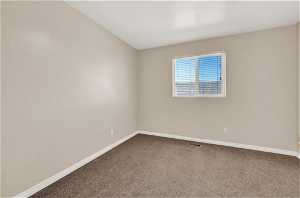 View of carpeted spare room in apartment