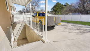 Basement entrance with wide stair well