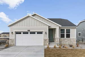 Craftsman inspired home featuring a garage