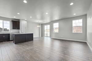 Kitchen featuring a wealth of natural light, a center island, and light hardwood / wood-style flooring