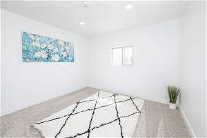 Unfurnished room with light colored carpet