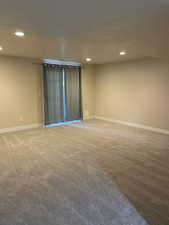 Empty room with light colored carpet