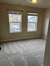 Empty room with carpet flooring