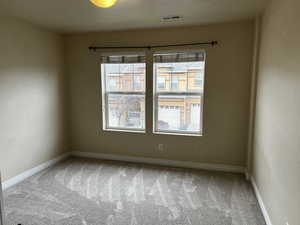 Empty room featuring carpet floors