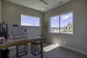 Home office featuring ceiling fan and tile flooring