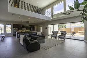 Tiled living room with a high ceiling