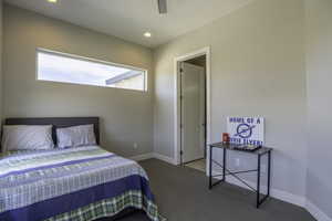 Bedroom featuring ceiling fan and carpet flooring