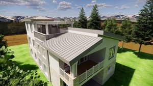 Exterior space featuring a mountain view and a yard