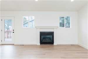 Unfurnished living room with light hardwood / wood-style floors