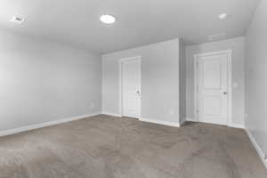 Unfurnished room with carpet floors