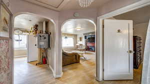 Hallway with light hardwood / wood-style flooring