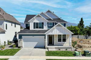 Craftsman-style house with a mountain view, cooling unit, a porch, and a garage