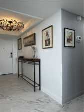 Entry Hallway featuring a tray ceiling