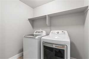 Laundry area with included washer and dryer