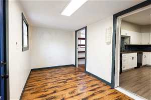 Laundry/mud room featuring plenty of natural light, dark hardwood / wood-style flooring