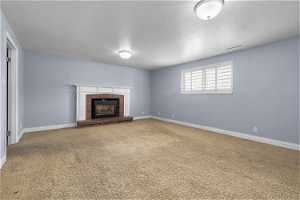 Basement family room with gas fireplace