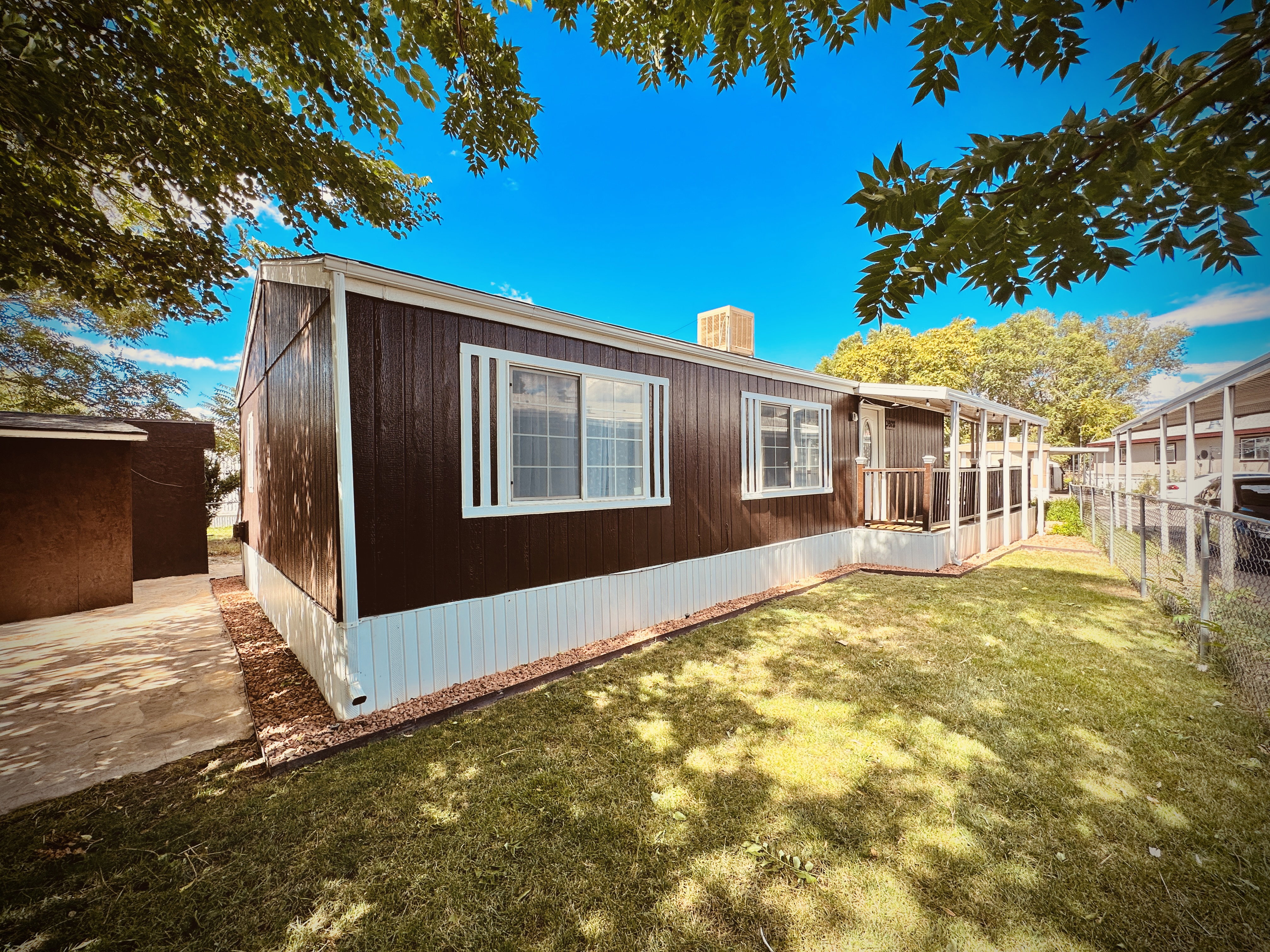 Rear view of house featuring a lawn