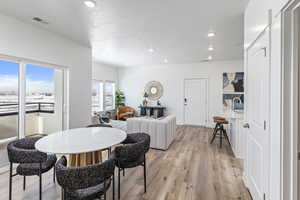 Dining space featuring light hardwood / wood-style floors and sink