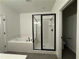 Bathroom with toilet and separate shower and tub