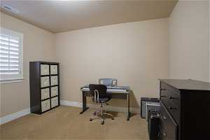 Office space featuring light colored carpet