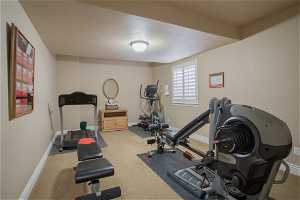 Workout area with light colored carpet