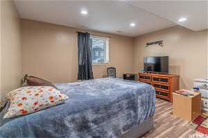 ADU Bedroom with light hardwood / wood-style flooring