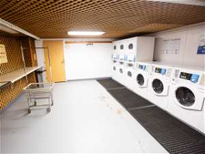 Washroom with washer and clothes dryer and stacked washer and dryer