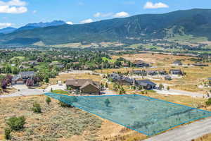 Birds eye view of property featuring a mountain view