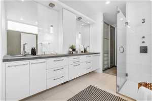 Master bath with his and her walk-in wardrobes