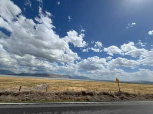 Property view of mountains featuring a rural view