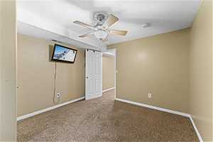 Bedroom 4 with a textured ceiling and ceiling fan