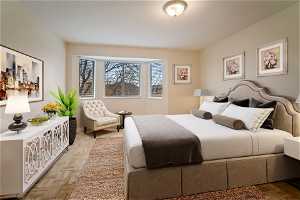 Bedroom with light parquet flooring