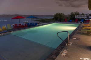 View of pool at dusk