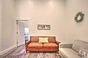 Living room with dark hardwood / wood-style floors