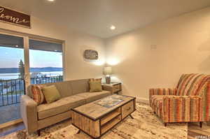 Living room featuring a water view and light wood-type flooring