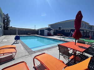 View of swimming pool featuring a patio