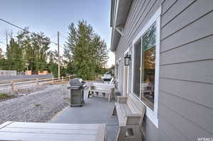 Wooden terrace featuring area for grilling