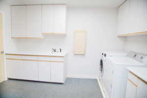 Laundry room with lots of cabinets and space