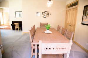 Dining area with light carpet