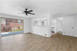 Interior Open space featuring light hardwood / wood-style floors and ceiling fan