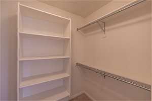 Master bedroom walk-in closet is accessed from master bath.