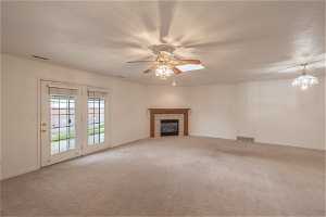 Large great room ideal for entertaining with access to covered patio.